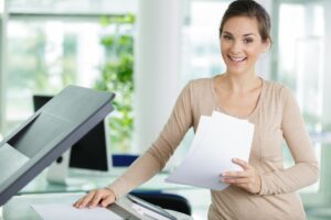 woman doing photocopies in the office